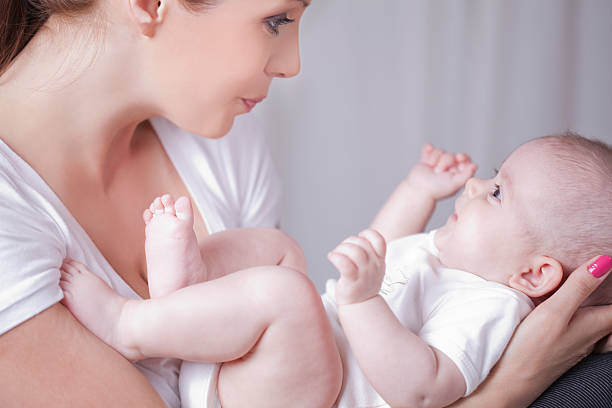 istock Mother playing with two monts old baby 178802074