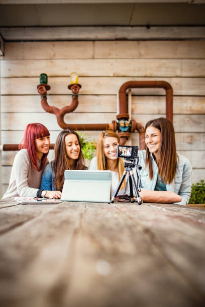istock Four friends doing a vlog video together. 1788025977