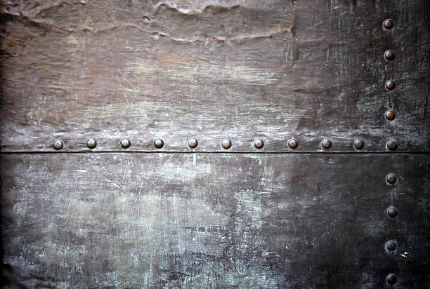 istock Black metal plate or armour texture with rivets 178803058