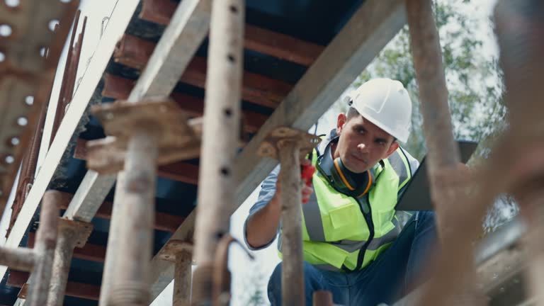 Engineer with confidence examining on inspection at the house construction site.