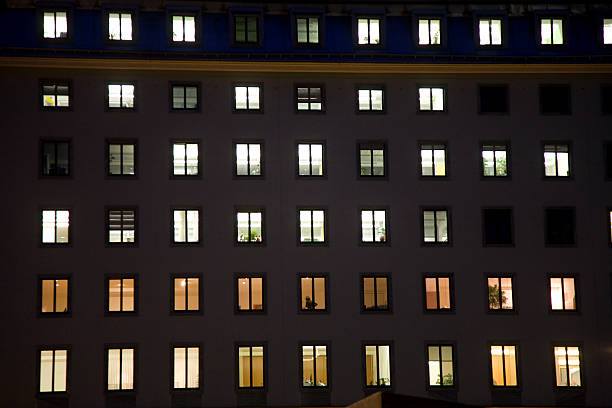 istock windows of a business house with light by night 178804040