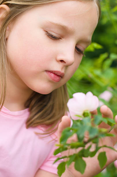 istock girl with flower 178804180