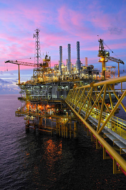 istock Offshore oil rig pictured at dusk 178804661