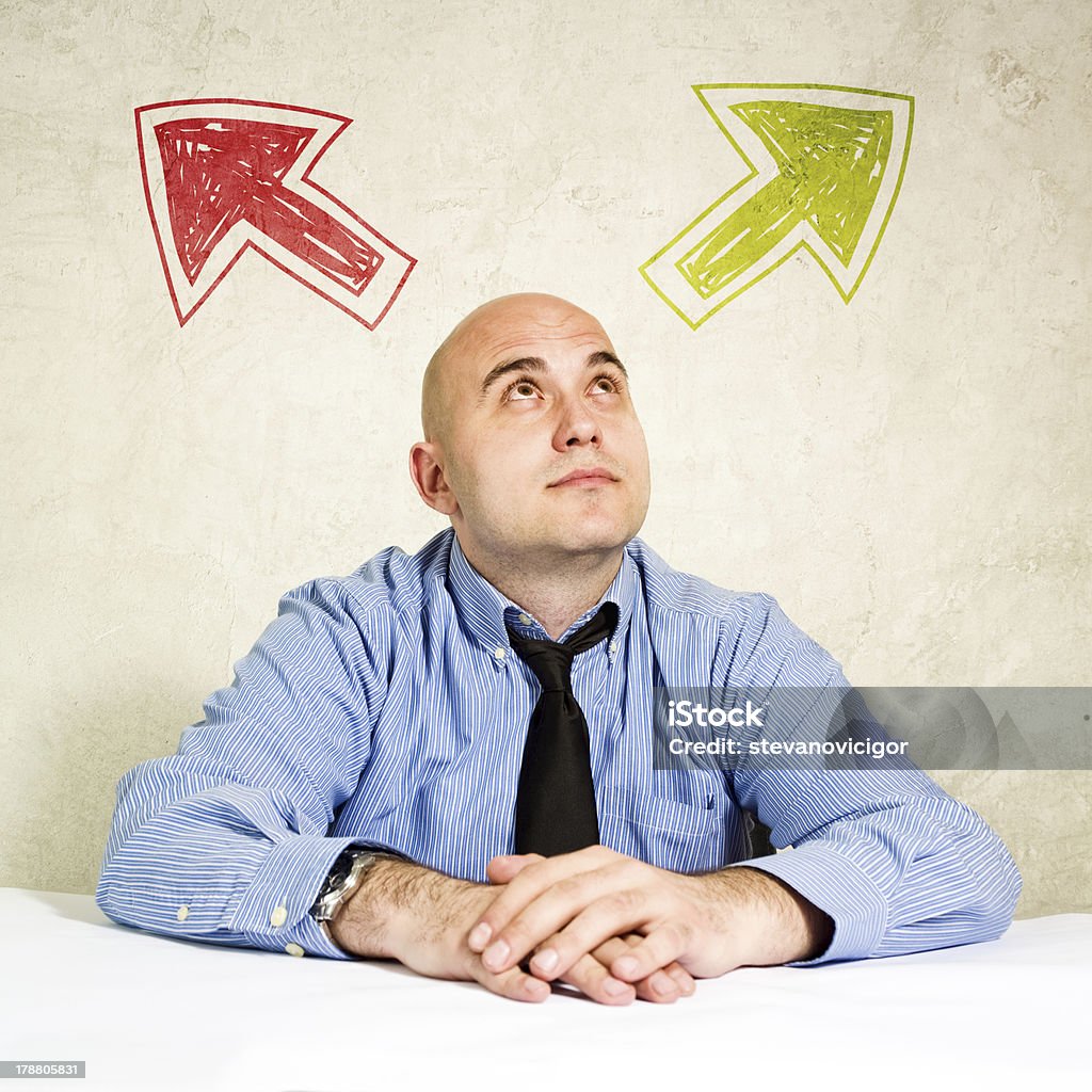 Business choice or making decision Business choice or making decision. Businessman looking at arrow above him. Concept of choice, choosing between possible solutions. Adult Stock Photo