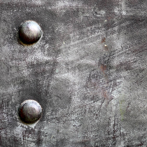 istock Black metal plate or armour texture with rivets 178806041