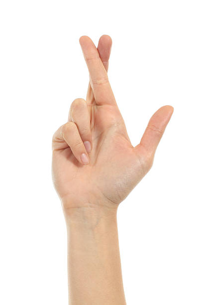 istock Woman hand crossing fingers 178806304