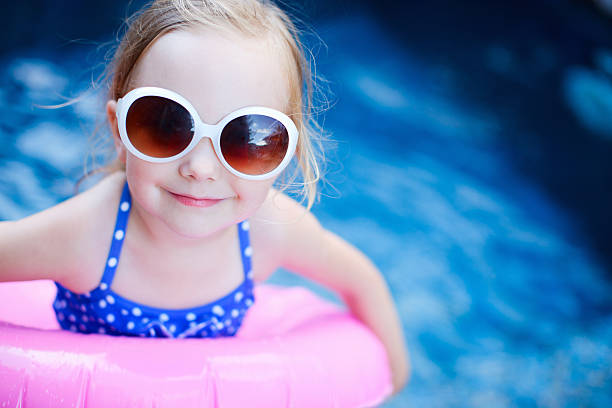 istock Little girl at swimming pool 178806559