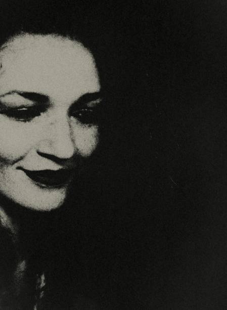 istock The smiling woman in the darkness. 1788067711