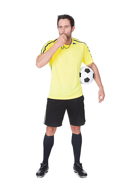 istock Soccer judge standing with ball 178807023