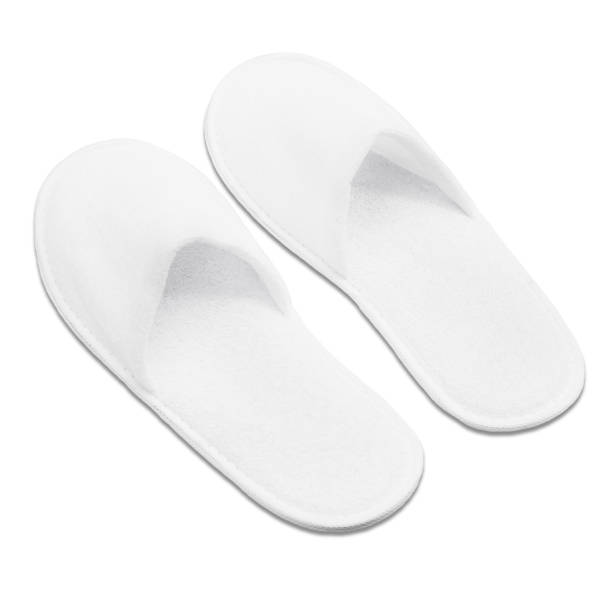 istock A pair of white disposable textile slippers on a white background. 1788070841