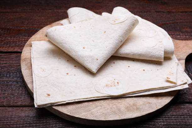 istock Delicious folded Armenian lavash on wooden table, closeup 1788070958