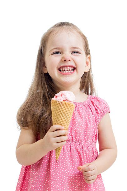 istock joyful child girl eating ice cream in studio isolated 178807435