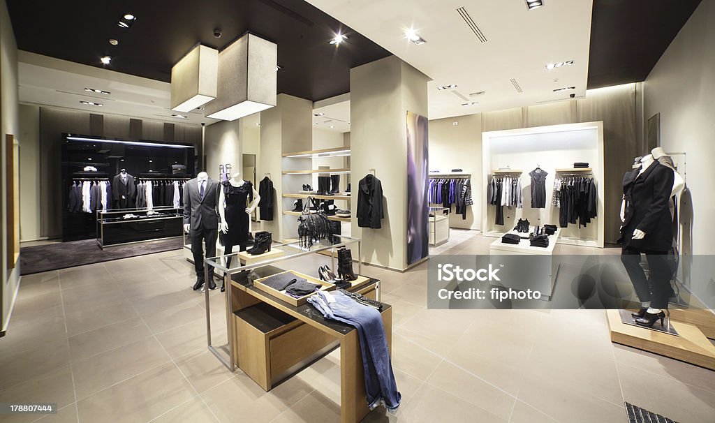 modern and fashion clothes store interior of brand new fashion clothes store Store Stock Photo