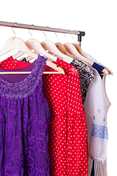 istock Dresses of different colors on wooden hangers 178807549