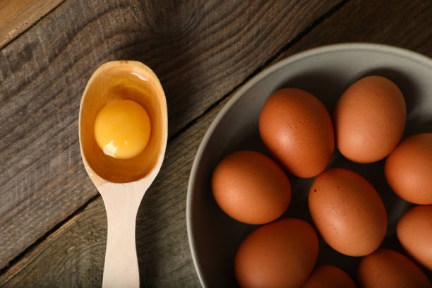 istock Raw chicken eggs on wooden table, flat lay 1788081531