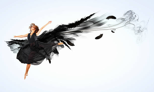 istock Woman floating   on dark wings 178810162