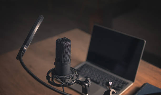 istock Interior of a home studio for podcasts. Large black Microphone, notebook and notebooks on table. Interior. Closeup 1788106071
