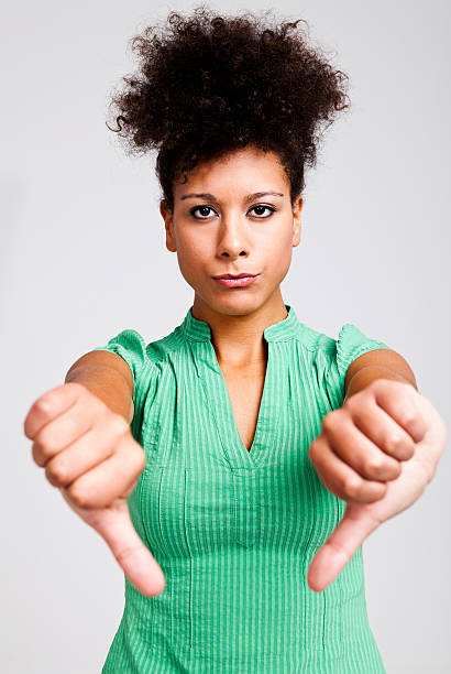 istock Beautiful woman with thumbs down 178811555