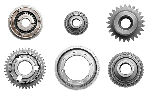 Set with different stainless steel gears on white background, top view