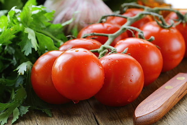 istock tomato cherry , lettuce, garlic and oil on a wooden table 178811809