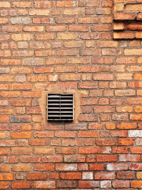 istock a brick wall with a metal heat exchange on it's side 1788119284