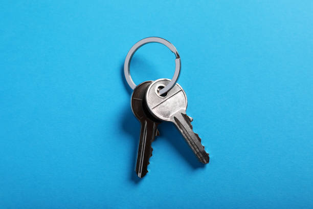 istock House keys on light blue background, top view. Real estate agent services 1788119788