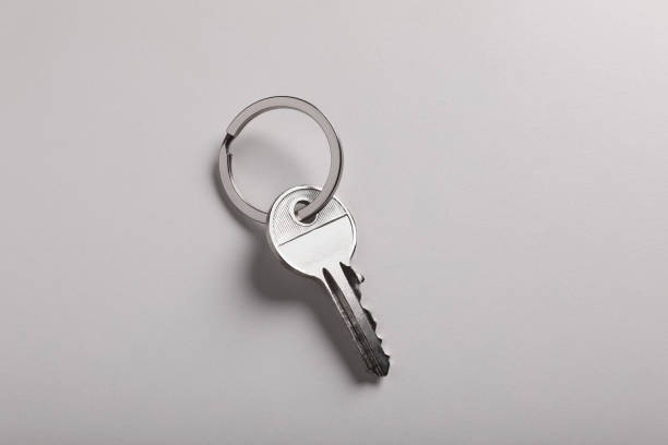 istock House key on light grey background, top view. Real estate agent services 1788119793