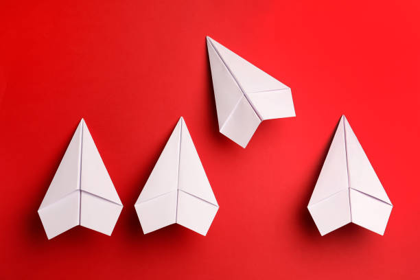 istock Flat lay composition with paper planes on red background 1788119798