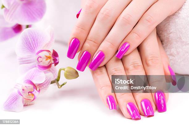 Beautyful Manicure With Fragrant Orchid And Towel Spa Stock Photo - Download Image Now