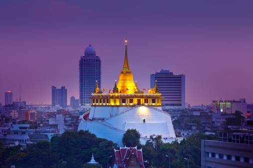 Phu Khao Thong or Golden mountain is a steep artificial hill inside the Wat Saket (Saket Temple), Bangkok, Thailand.