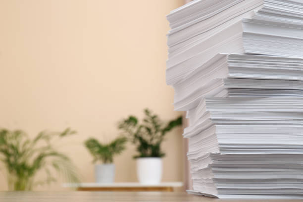 istock Stack of paper sheets on wooden table indoors. Space for text 1788125169