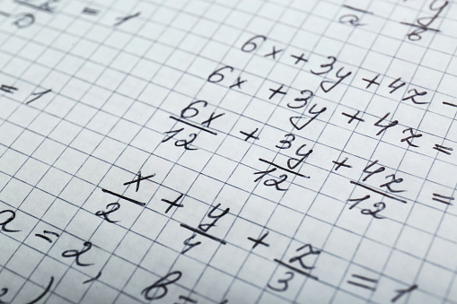 Sheet of paper with different mathematical formulas, closeup