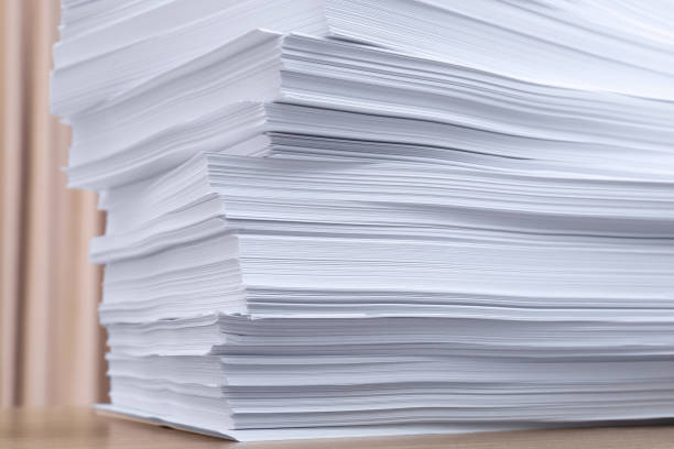 istock Stack of paper sheets on wooden table indoors, closeup 1788127975