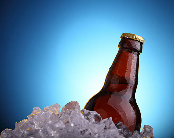 Beer in ice stock photo