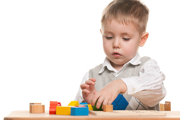 istock Serious little boy at the desk 178813269