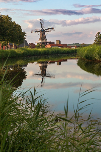 Veelerveen, Groningen/The Netherlands 7/16/2020: Niemans Meuln in Veelerveen is één van de kleinste korenmolens van Nederland. Aanvankelijk stond de molen als poldermolen in de buurt van Midwolda, maar hij is in 1916 herbouwd als korenmolen met stelling. De molen dankt haar naam aan de familie Nieman.