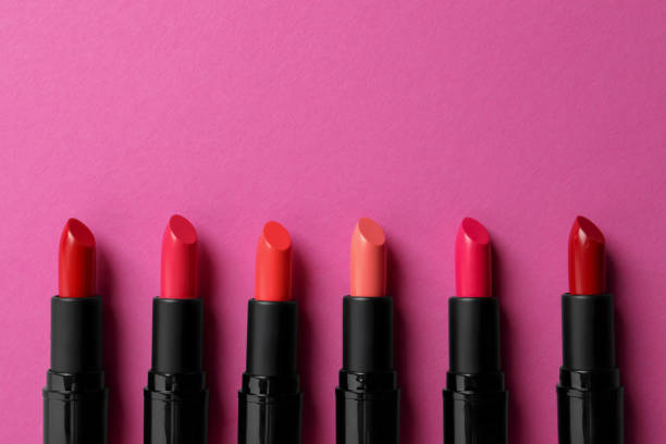 istock Beautiful lipsticks on pink background, flat lay. Space for text 1788144603