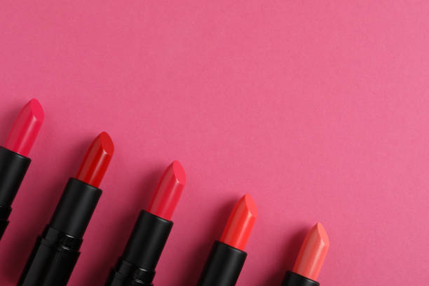 istock Beautiful lipsticks on pink background, flat lay. Space for text 1788145338