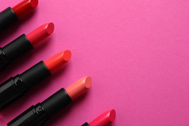 istock Beautiful lipsticks on pink background, flat lay. Space for text 1788145352
