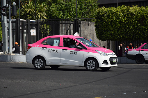 Mexico City, Mexico - 3rd January, 2019: Hyundai Grand i10 Sedan in taxi version driving on a street. This model is a popular vehicle in taxi corporations in Mexico.