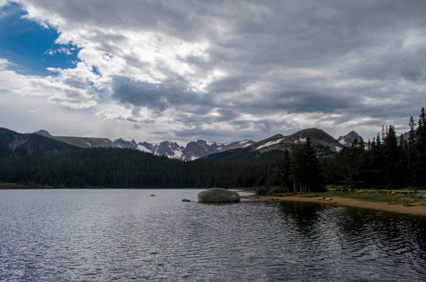 istock Tranquil lake surrounded by majestic mountains in Colodaro 1788159834