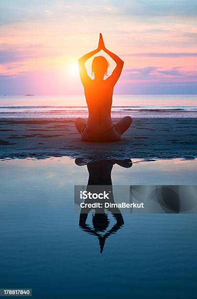 Young Woman Practicing Yoga On The Beach At Sunset Stock Photo - Download Image Now - Activity, Adult, Balance