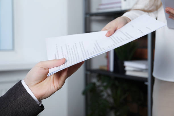 istock Woman giving many documents to man in office, closeup 1788178498