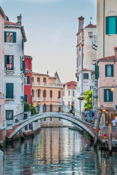 istock a bridge that is above some water next to buildings and a building 1788182165