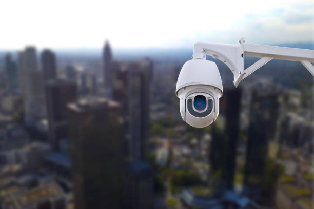 istock CCTV Camera Operating with city in background. 1788184252