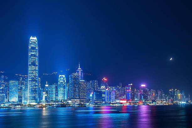 Hong Kong Moon over victoria Harbor of Hong Kong hong kong moon night stock pictures, royalty-free photos & images