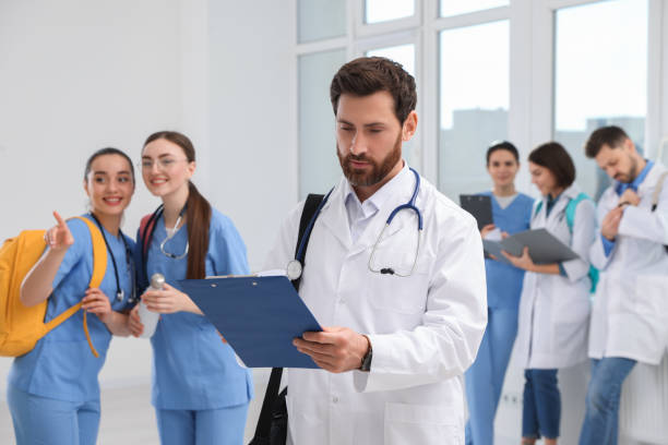 istock Smart medical student with clipboard in college hallway 1788201490