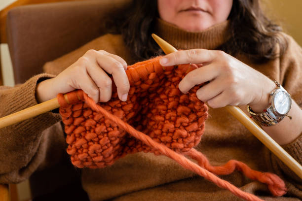 istock Relaxed girl knitting at home. 1788203050