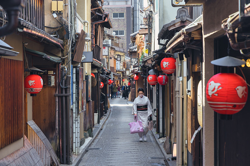Kyoto, Japan - April 17, 2023: view of the Ponto-cho district in the early morning, with unidentified people. It is a hanamachi district in Kyoto, Japan, known for its geisha and maiko culture