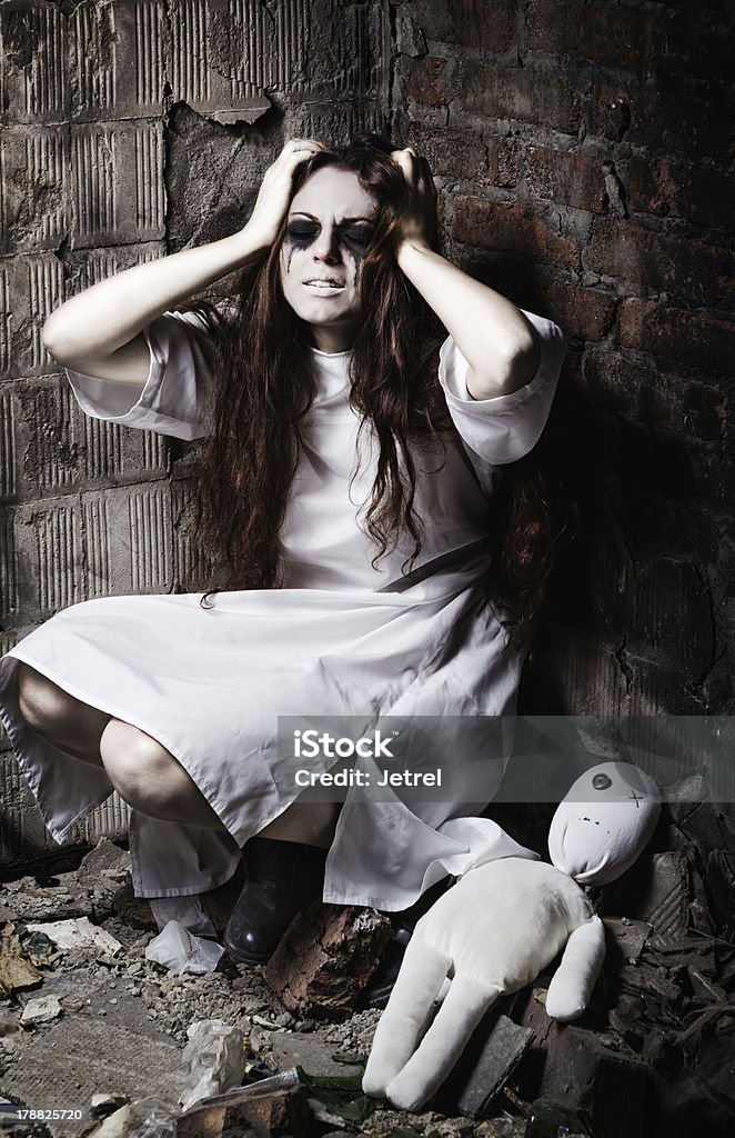 Horror style shot: strange crazy girl and her moppet doll Horror style shot: the strange crazy girl and her moppet doll Adult Stock Photo